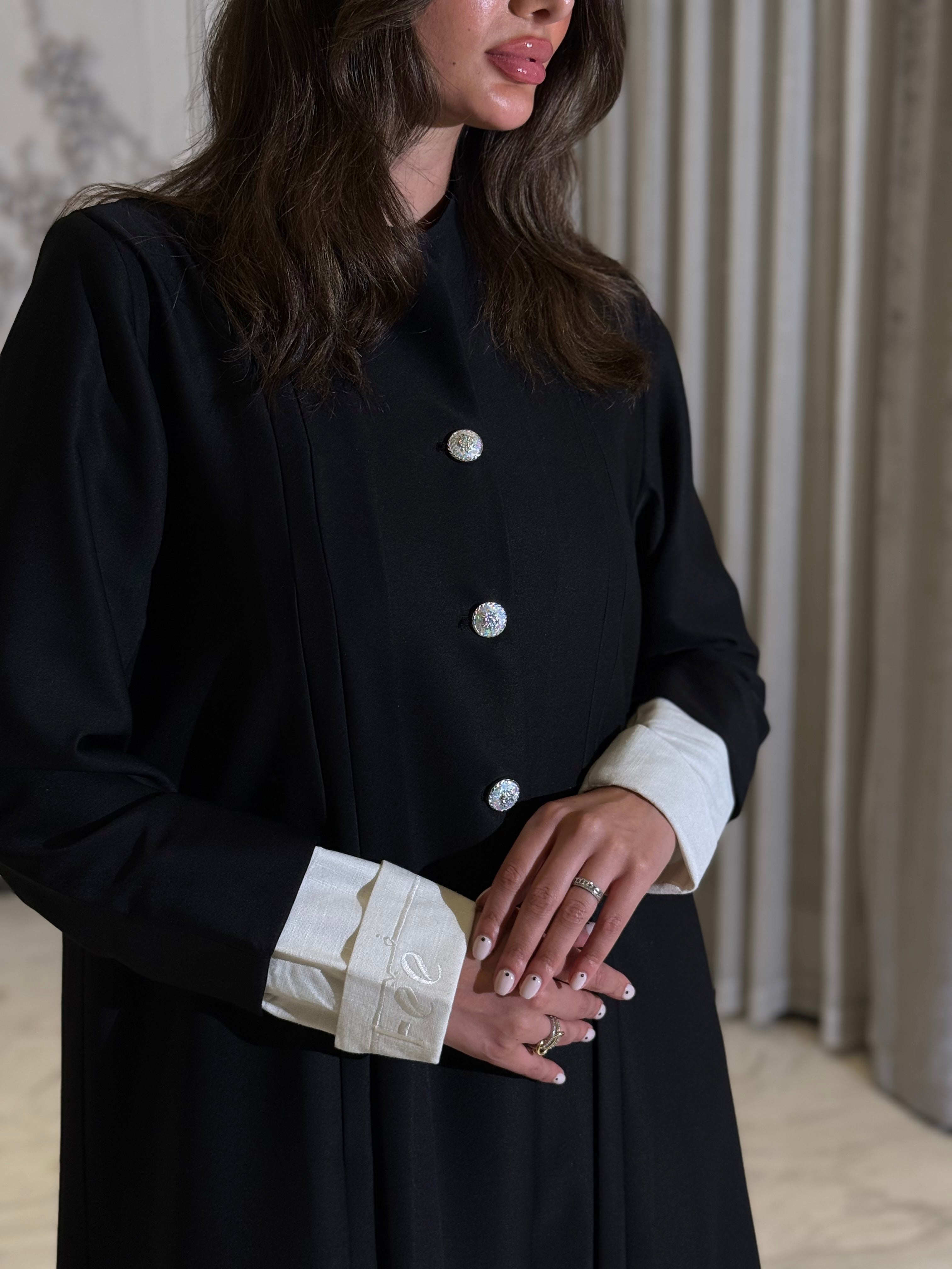 The Dantel Collection. A practical crepe silhouette defined by elegant pleats