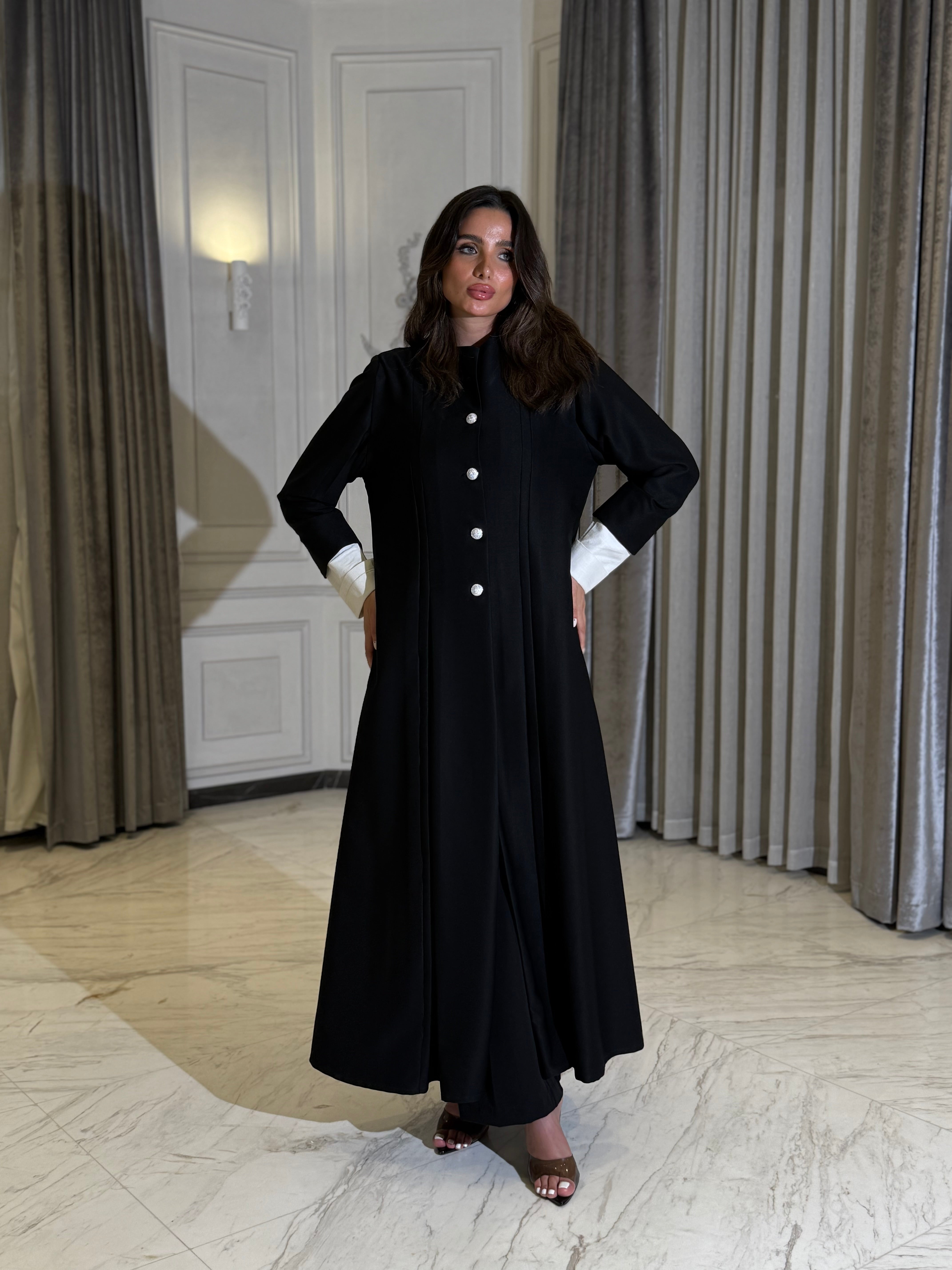 The Dantel Collection. A practical crepe silhouette defined by elegant pleats